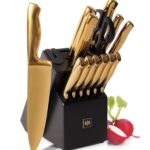 Gold Knife set in a black block with scissors.